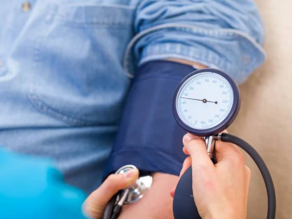 Person having their blood pressure taken